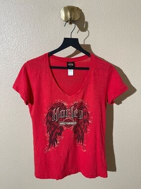 Harley Davidson red v neck tee with wings design. Size M